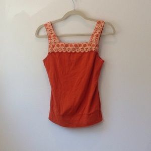 Orange tank top.